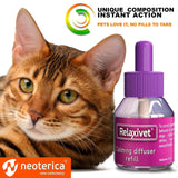 Cat sitting beside Relaxiv calming diffuser bottle, promoting natural stress relief for pets