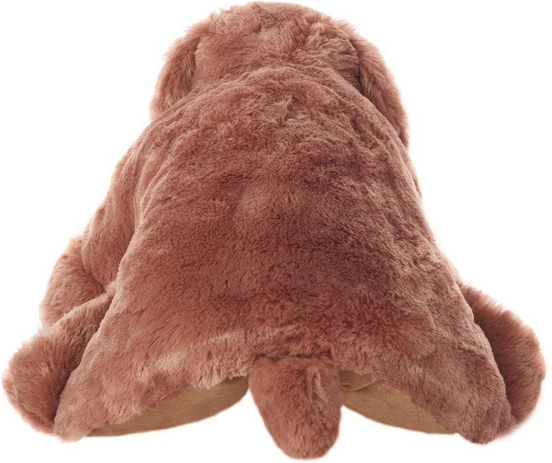 Top-down view of plush brown dog pillow showing full shape and limbs
