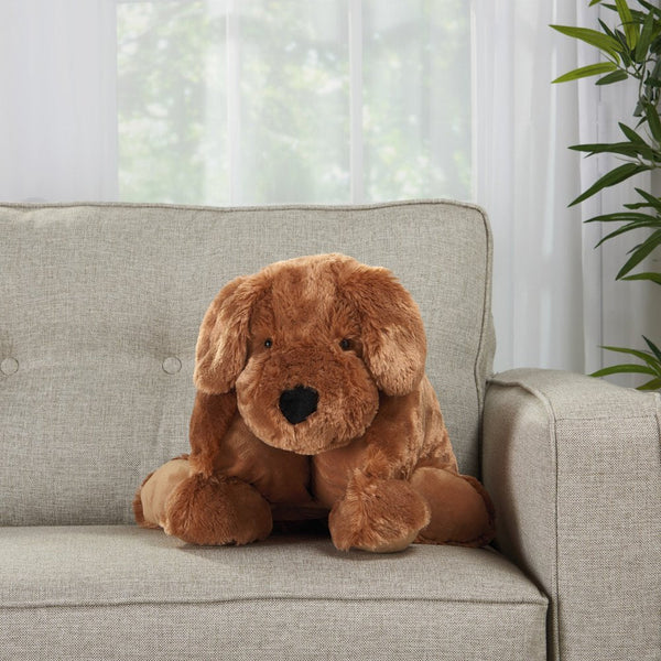 Brown dog-shaped throw pillow on gray sofa in cozy living room
