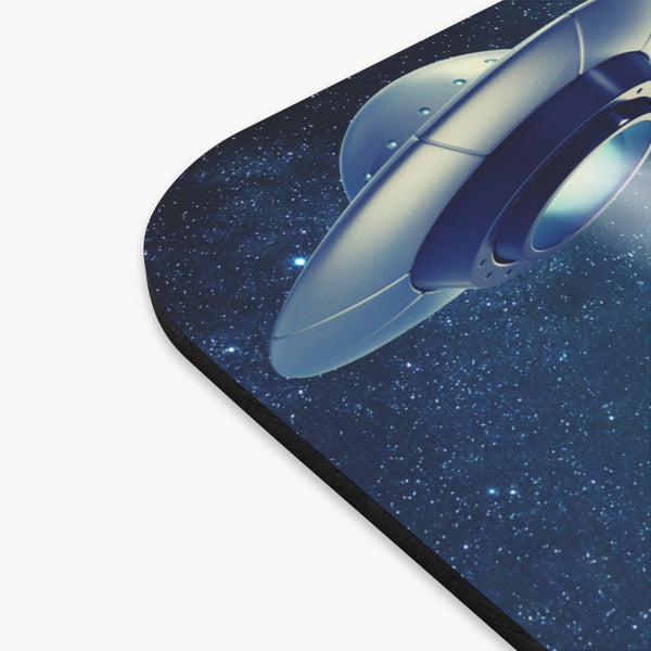 Side view of mouse pad showing UFO beaming light in starry sky