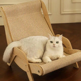 White fluffy cat relaxing on a sisal wooden cat lounge chair placed on wooden flooring