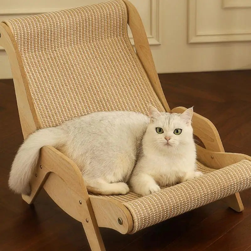 White fluffy cat relaxing on a sisal wooden cat lounge chair placed on wooden flooring