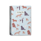 Closed front view of dog-themed spiral notebook with cartoon dog breeds on a blue background