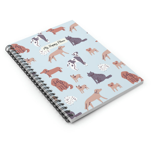 Flat lay of dog-themed spiral notebook with playful canine illustrations