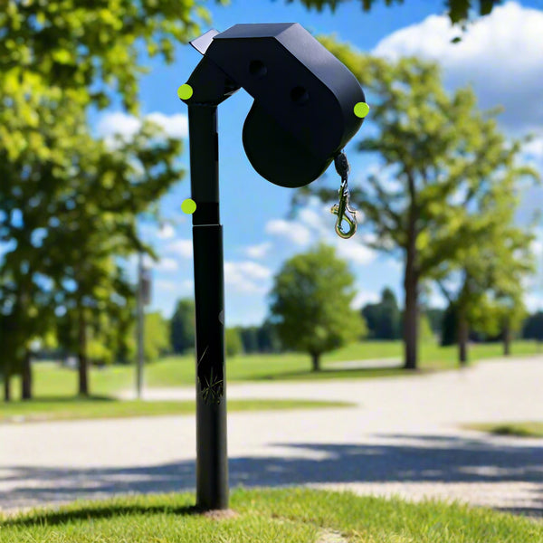 DogKeeper wall leash holder installed on lawn with clear blue sky in the background