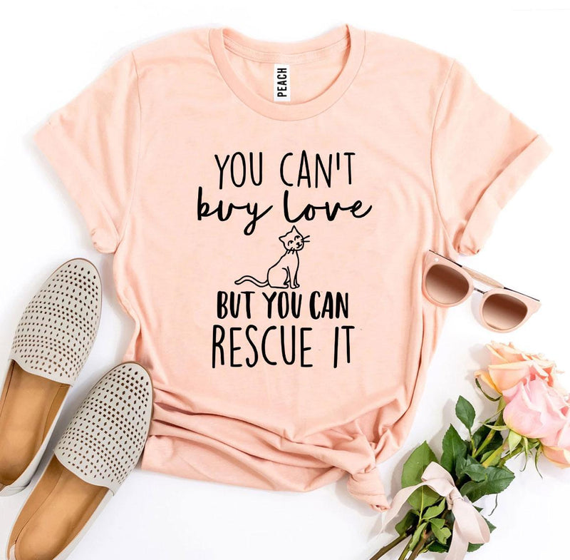 Peach-colored pet rescue T-shirt styled with sneakers and flowers