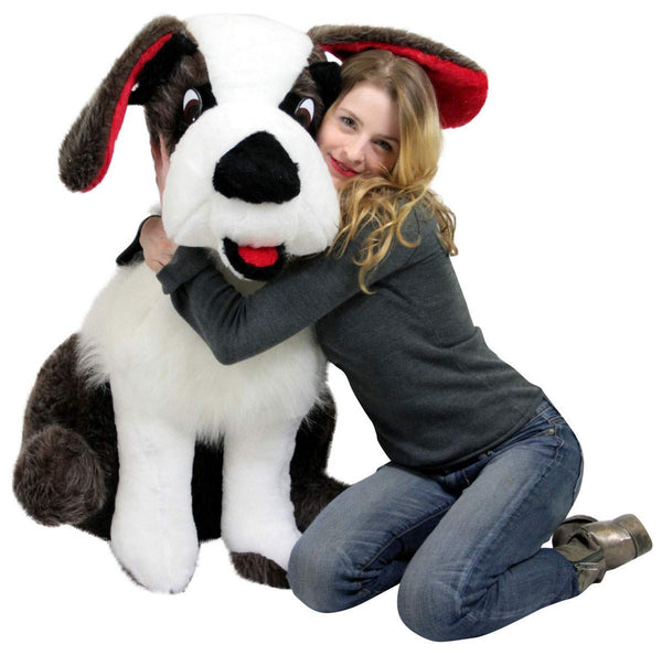 Girl hugging life-size 38-inch realistic stuffed Saint Bernard plush dog