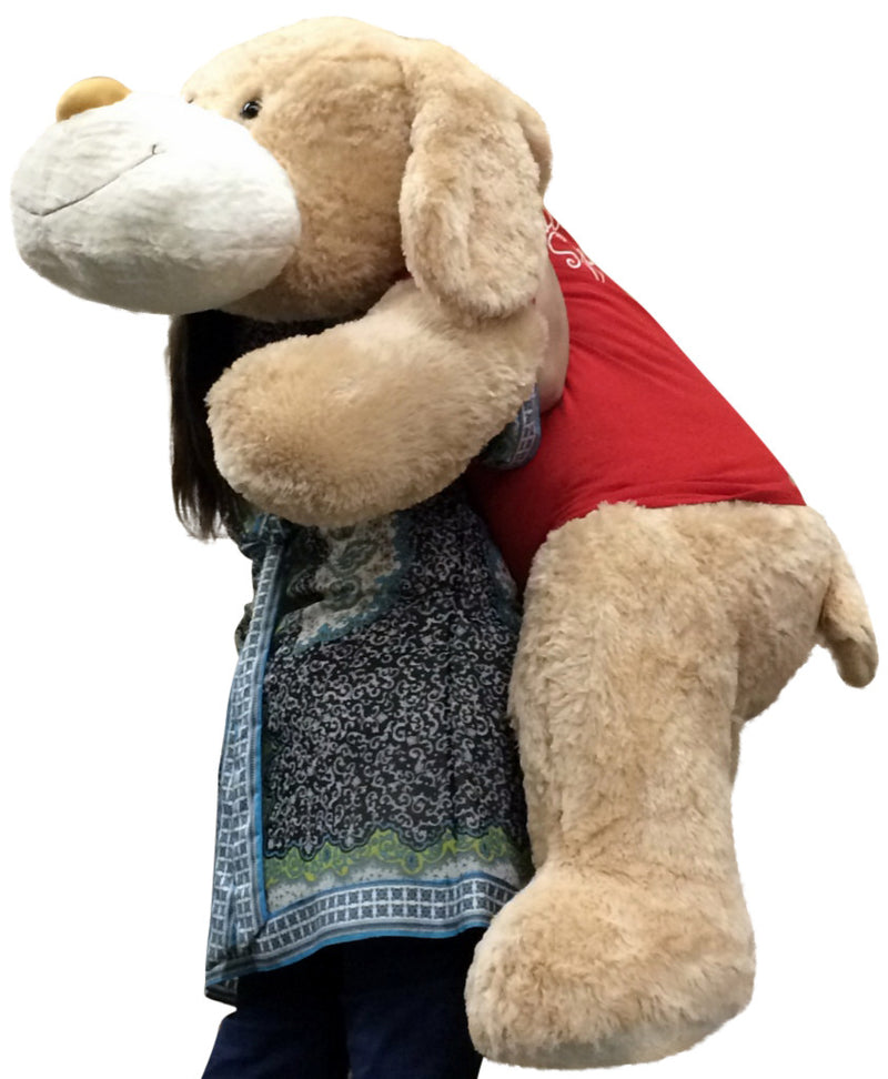 Side view of 5ft Valentine’s Day plush dog wearing red shirt